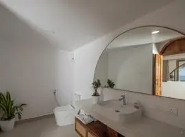 A modern bathroom with a spacious mirror and a sleek sink, perfect for getting ready in style.