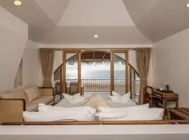 Peaceful bedroom with stunning ocean vista, great for calming vibes.